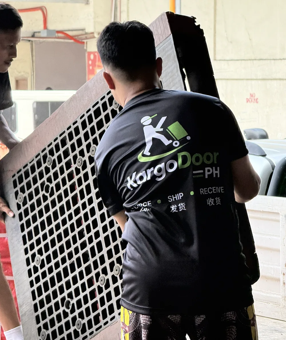 A KargoDoor PH kargador carrying cargo at the warehouse